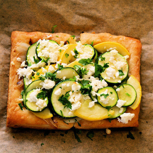 Everything about this summer squash tart is great, from the ricotta-parsley spread to the caramelized onions to the blanched squash rounds to the barely melted feta crumbled on top at the last moments of baking. // alexandracooks.com Everything about this summer squash tart is great, from the ricotta-parsley spread to the caramelized onions to the blanched squash rounds to the barely melted feta crumbled on top at the last moments of baking. // alexandracooks.com