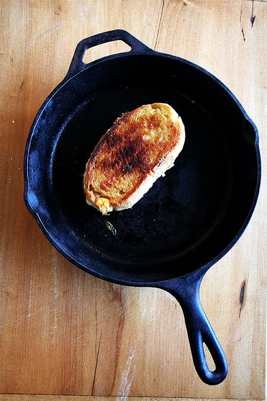 Saveur's recipe for "the ultimate grilled cheese sandwich" calls for placing a cast-iron skillet over low heat and cooking the sandwich, flipping once, for 20 minutes. Who knew it took so long to make a grilled cheese sandwich? I did in fact cook my grilled cheese for 20 minutes and, thanks to a hefty slathering of butter, my sandwich crisped up nicely in my cast-iron pan. // alexandracooks.com Saveur's recipe for "the ultimate grilled cheese sandwich" calls for placing a cast-iron skillet over low heat and cooking the sandwich, flipping once, for 20 minutes. Who knew it took so long to make a grilled cheese sandwich? I did in fact cook my grilled cheese for 20 minutes and, thanks to a hefty slathering of butter, my sandwich crisped up nicely in my cast-iron pan. // alexandracooks.com