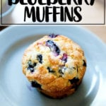 An overhead shot of a lemon blueberry muffin on a plate.