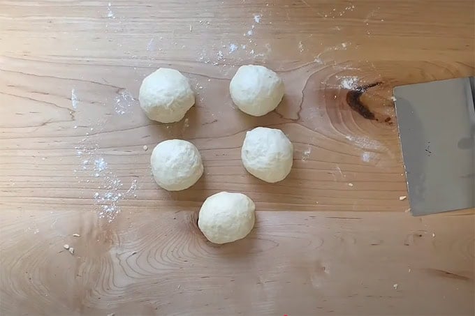 5 tortilla dough balls.