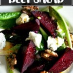 Salt-roasted beet salad on a plate with walnuts and goat cheese.