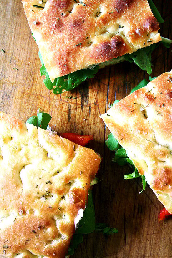 Next time you are invited to a potluck picnic, volunteer to make sandwiches. And then make these roasted red pepper and arugula sandwiches on homemade focaccia. You will be loved forever. I promise. // alexandracooks.com Next time you are invited to a potluck picnic, volunteer to make sandwiches. And then make these roasted red pepper and arugula sandwiches on homemade focaccia. You will be loved forever. I promise. // alexandracooks.com