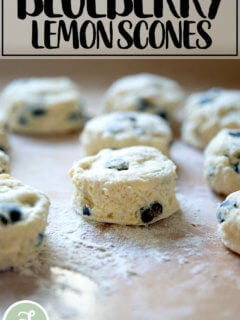 Unbaked lemon blueberry scones on a sheet pan.