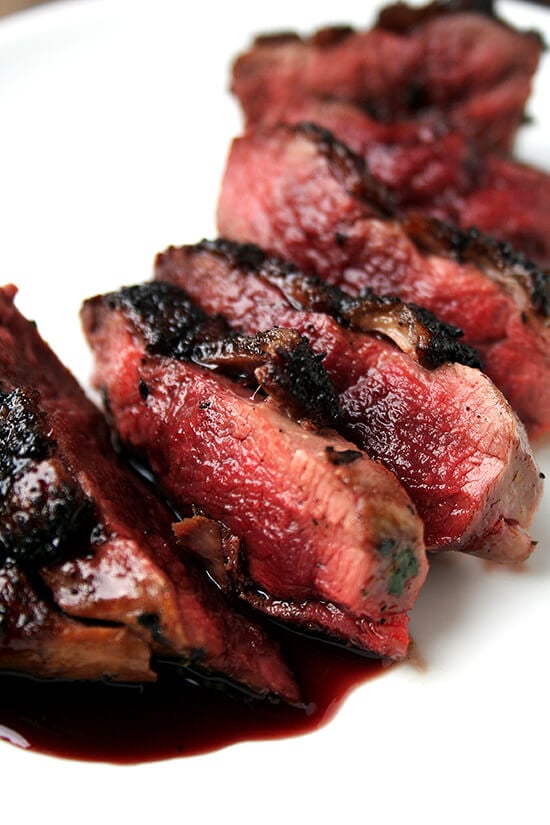 This Sally Schneider recipe for seared duck breasts with port wine reduction is a good one to have in your repertoire — it's simple yet it's bistro quality. This is a perfect dish for a date night at home. // alexandracooks.com Pan-seared and sauced wild duck breast on a plate.
