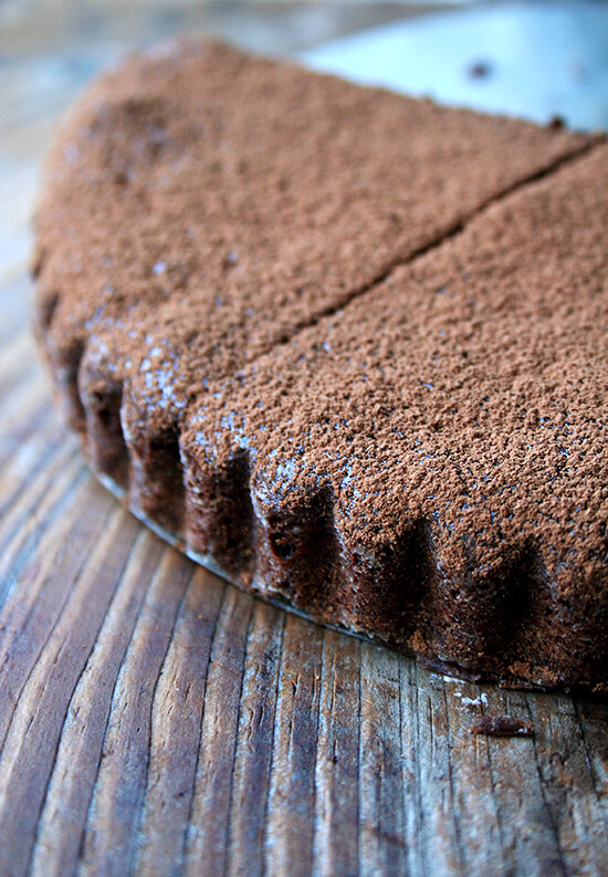 In this chocolate tart, whipped egg whites lighten a fudgy base of dark chocolate, melted butter and egg yolks. Almond flour provides nearly all of the structure as well as a wonderful flavor, and confectioners' sugar sweetens it ever so slightly. Light and rich at the same time, it demands a dollop of homemade whipped cream. It's not Valentine's Day without some sort of chocolate indulgence, and this tart couldn't be more perfect for the occasion. // alexandracooks.com In this chocolate tart, whipped egg whites lighten a fudgy base of dark chocolate, melted butter and egg yolks. Almond flour provides nearly all of the structure as well as a wonderful flavor, and confectioners' sugar sweetens it ever so slightly. Light and rich at the same time, it demands a dollop of homemade whipped cream. It's not Valentine's Day without some sort of chocolate indulgence, and this tart couldn't be more perfect for the occasion. // alexandracooks.com