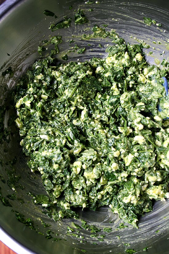 filling A large bowl filled with spanakopita filling.