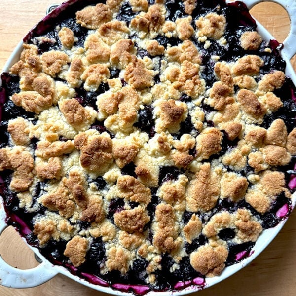 A gratin dish filled with Lemon-Blueberry Crisp.