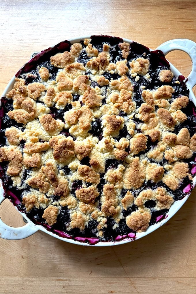 A gratin dish filled with Lemon-Blueberry Crisp.