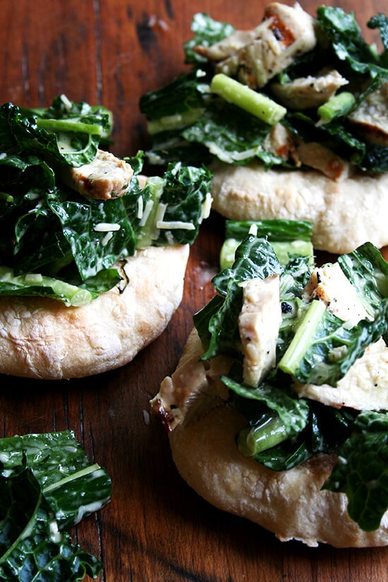I'm planning a dinner party and thought it might be fun to make little flatbreads — "piadines" I saw them called — piled high with caesar salad — boring, I know, but perhaps made interesting by kale — tossed with sliced grilled chicken breasts — boring, I know, but chicken caesar kale salad is safe. I love this kind of thing, when bread and vegetable and meat are all wrapped up in one casual, fun, summery, light dish. // alexandracooks.com I'm planning a dinner party and thought it might be fun to make little flatbreads — "piadines" I saw them called — piled high with caesar salad — boring, I know, but perhaps made interesting by kale — tossed with sliced grilled chicken breasts — boring, I know, but chicken caesar kale salad is safe. I love this kind of thing, when bread and vegetable and meat are all wrapped up in one casual, fun, summery, light dish. // alexandracooks.com