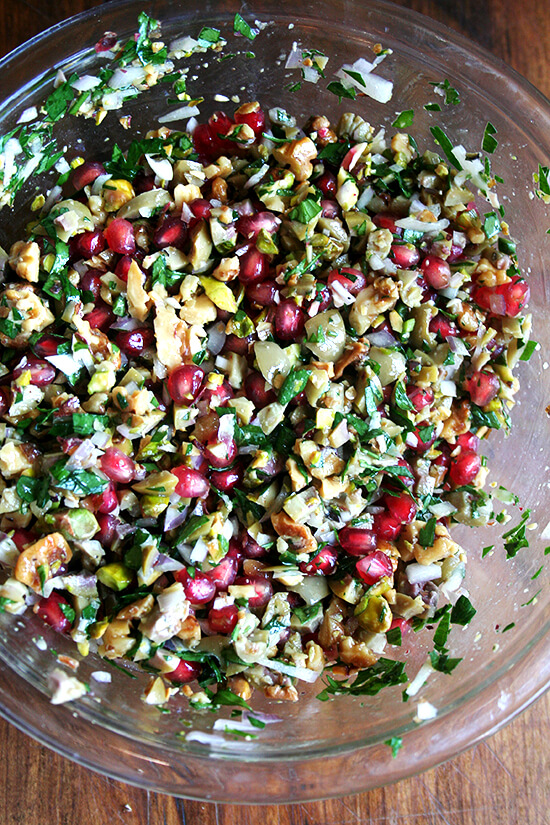 This pomegranate salad recipe comes from the book Turquoise by Greg and Lucy Malouf, which my aunt introduced to the family last winter when she served this stunning salad at a dinner party. The myriad textures and sweet-salty-hot dressing make this salad irresistible. // alexandracooks.com This pomegranate salad recipe comes from the book Turquoise by Greg and Lucy Malouf, which my aunt introduced to the family last winter when she served this stunning salad at a dinner party. The myriad textures and sweet-salty-hot dressing make this salad irresistible. // alexandracooks.com