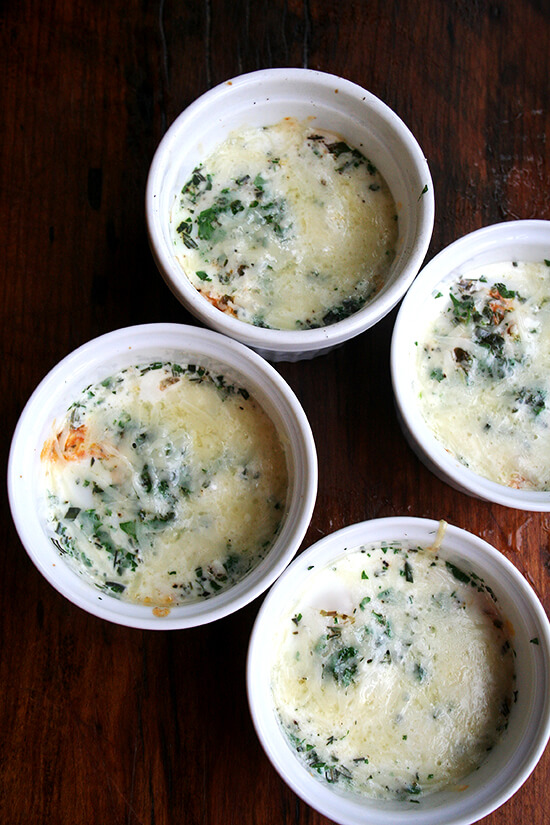 4 just-baked baked (shirred) eggs.