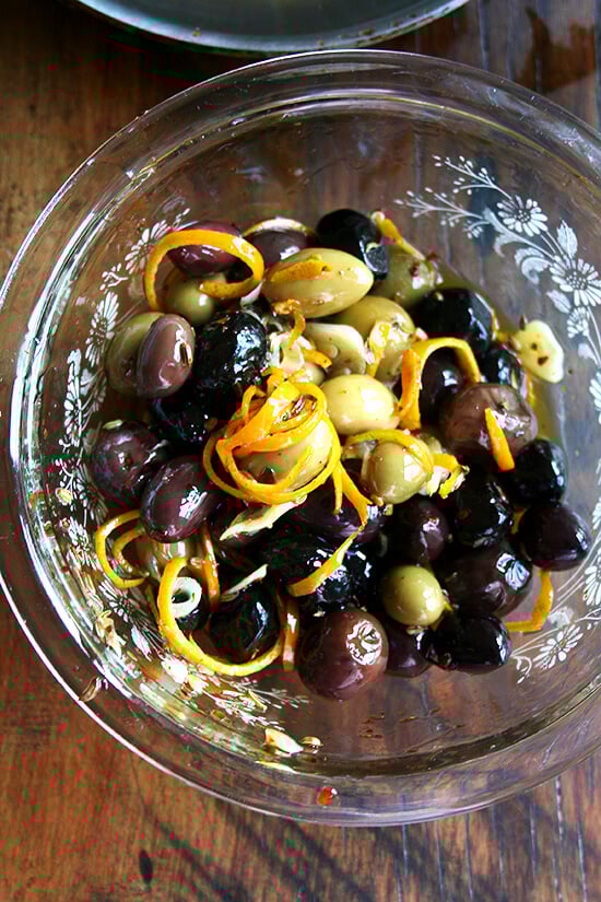 Marinated olives are about as easy as it gets as far as sprucing up the hors d'oeuvres spread goes — a little garlic and orange zest along with a few spices (crushed red pepper flakes and fennel seed) go a long way, and these flavor elements look so pretty in the serving dish as well. // alexandracooks.com Marinated olives are about as easy as it gets as far as sprucing up the hors d'oeuvres spread goes — a little garlic and orange zest along with a few spices (crushed red pepper flakes and fennel seed) go a long way, and these flavor elements look so pretty in the serving dish as well. // alexandracooks.com