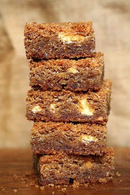 To me, these brown butter blondies are heaven, a perfect balance of sweet and salty, impossible not to nibble on all day long. The brown butter provides all of the nuttiness and deliciousness promised by its many fans. These are particularly good with a glass of milk, but I can't pretend I haven't enjoyed them aside morning coffee and afternoon tea as well. // alexandracooks.com A stack of brown butter blondies.