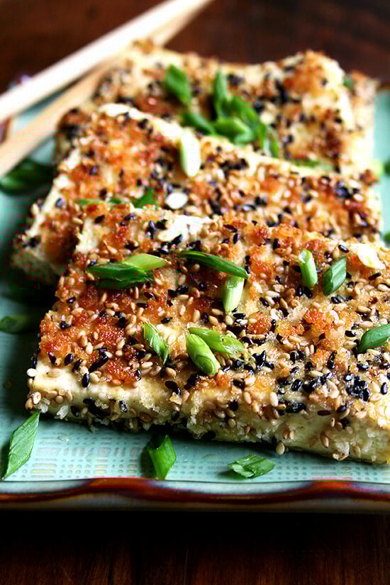 Sesame-crusted tofu on a platter.
