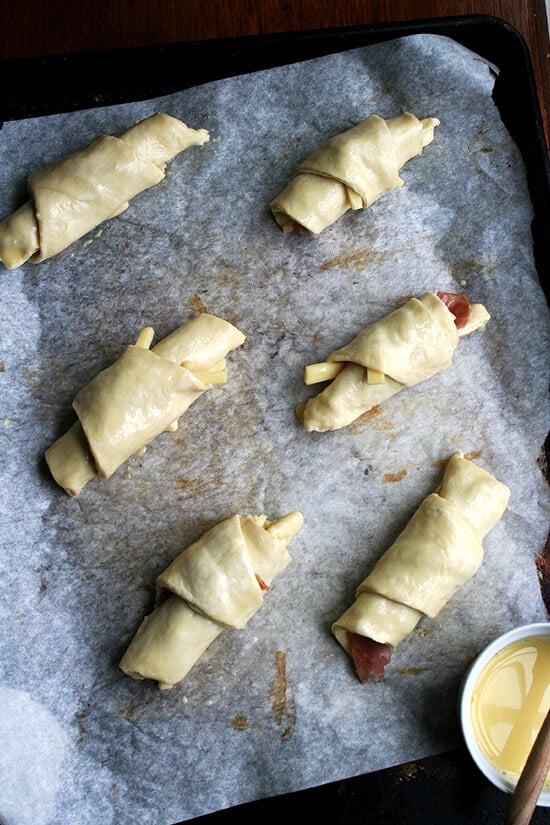Ham and cheese croissants, brushed with an egg wash. 