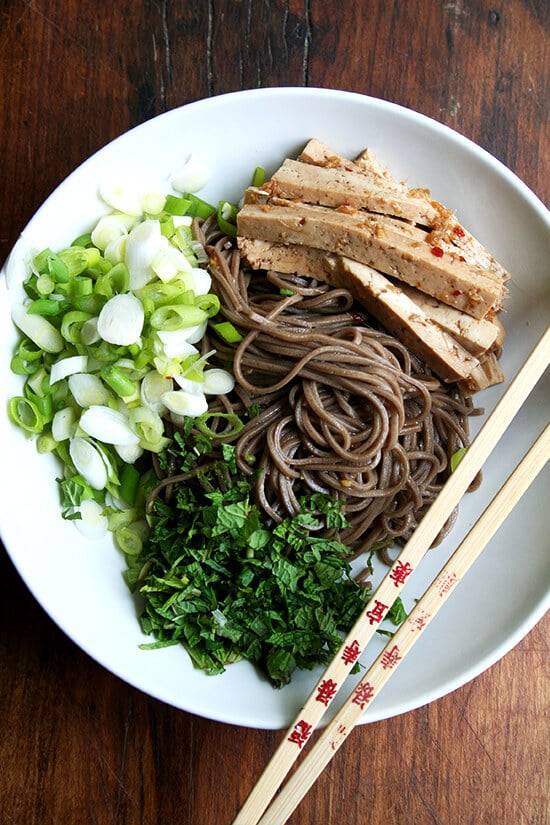 In this soba noodle salad, both the tofu and noodles are dressed with the same ginger and garlic soy-based dressing. It's a great dressing to use with any number of Asian noodles, but it excels in one area in particular: complete tofu domination. // alexandracooks.com In this soba noodle salad, both the tofu and noodles are dressed with the same ginger and garlic soy-based dressing. It's a great dressing to use with any number of Asian noodles, but it excels in one area in particular: complete tofu domination. // alexandracooks.com
