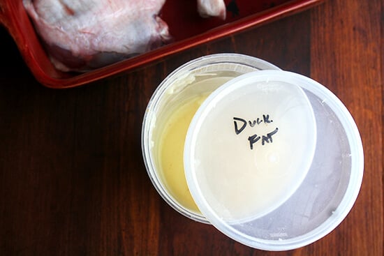 A quart container filled with duck fat.