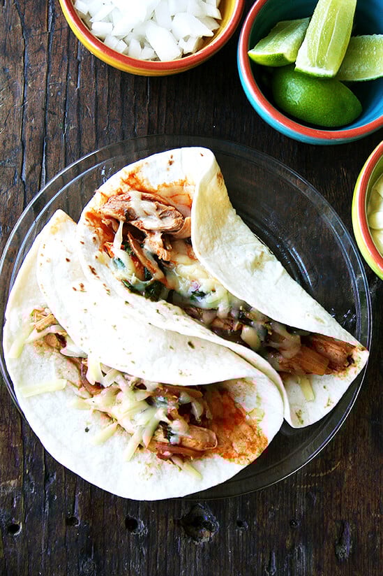 Tinga is something you should add to your repertoire. Made with only a handful of ingredients, tinga derives most of its flavor from chipotles in adobo sauce, which offer both smoke and heat. // alexandracooks.com A plate of 2 tinga tacos.