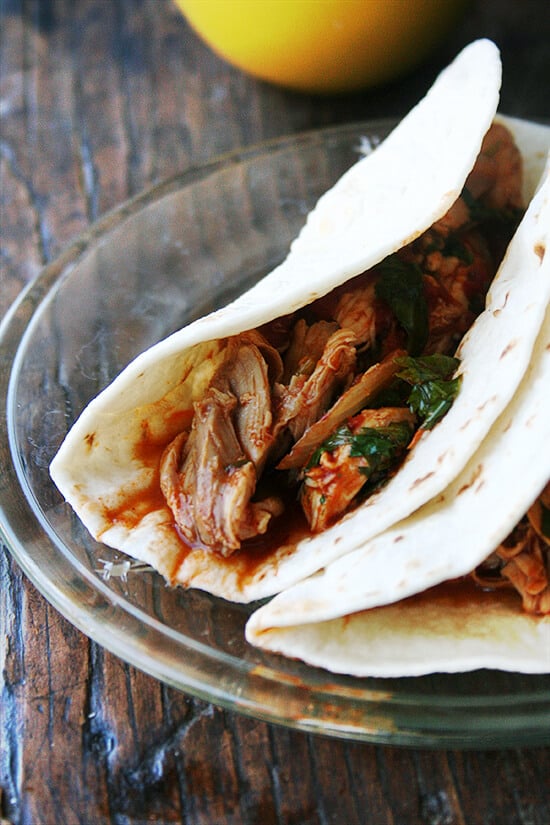 Tinga is something you should add to your repertoire. Made with only a handful of ingredients, tinga derives most of its flavor from chipotles in adobo sauce, which offer both smoke and heat. // alexandracooks.com A plate of chicken tinga tacos.