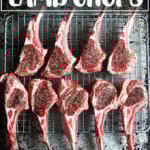 Un-broiled lamb chops on a sheet pan.