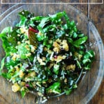 A plate of Swiss chard salad with parmesan and breadcrumbs.