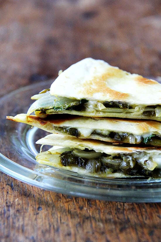 There is something so good about this simple quesadilla, about tasting each element — the smoky peppers and sweet onions, the bright cilantro, the creamy, melty Jack. As with pizza, less is more with quesadillas — a thin layer of ingredients is best. Before serving, I love stretching open the cheese-locked layers and dropping in spoonfuls of sour cream. // alexandracooks.com There is something so good about this simple quesadilla, about tasting each element — the smoky peppers and sweet onions, the bright cilantro, the creamy, melty Jack. As with pizza, less is more with quesadillas — a thin layer of ingredients is best. Before serving, I love stretching open the cheese-locked layers and dropping in spoonfuls of sour cream. // alexandracooks.com