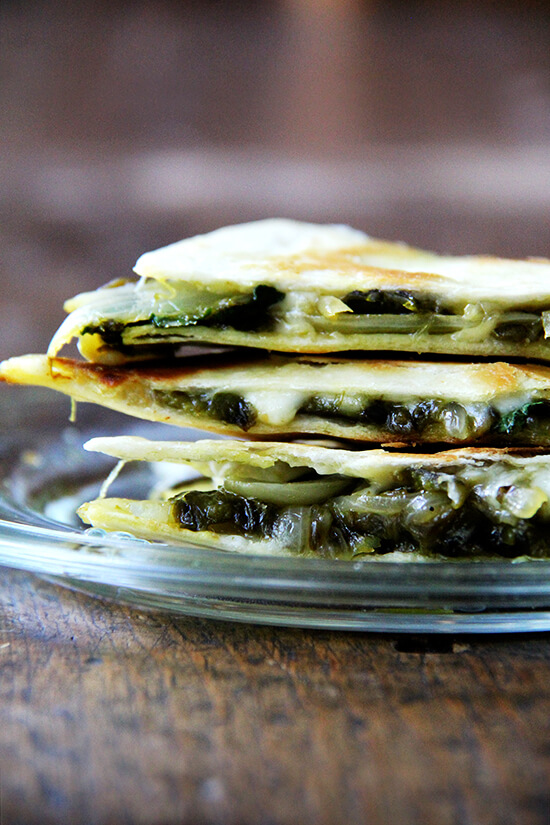 There is something so good about this simple quesadilla, about tasting each element — the smoky peppers and sweet onions, the bright cilantro, the creamy, melty Jack. As with pizza, less is more with quesadillas — a thin layer of ingredients is best. Before serving, I love stretching open the cheese-locked layers and dropping in spoonfuls of sour cream. // alexandracooks.com There is something so good about this simple quesadilla, about tasting each element — the smoky peppers and sweet onions, the bright cilantro, the creamy, melty Jack. As with pizza, less is more with quesadillas — a thin layer of ingredients is best. Before serving, I love stretching open the cheese-locked layers and dropping in spoonfuls of sour cream. // alexandracooks.com