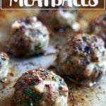 Broiled lamb meatballs on a sheet pan.