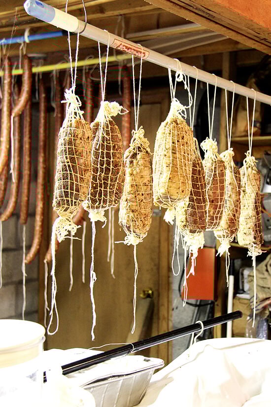 Homemade sausages hanging from the ceiling of Antonietta's basement.