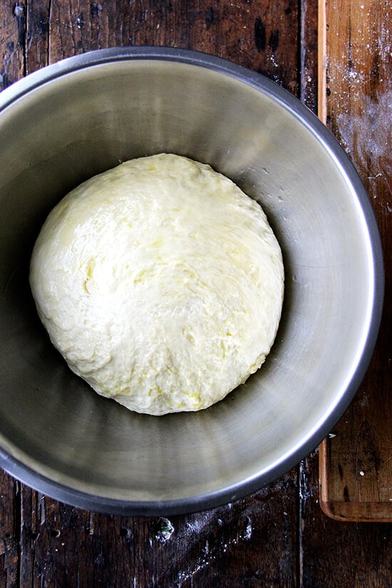 A bowl of challah bread dough in a bowl, ready to rise.
