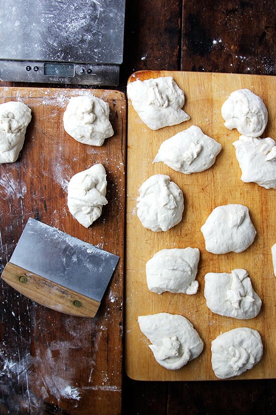 A board holding portioned bialy dough.