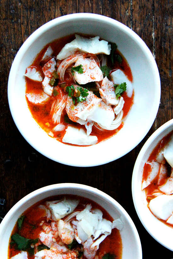 This carrot somen haddock soup is seasoned with lemongrass, chilies and lime, a recipe from a cookbook, The Chefs of the Times, I've had for years. The broth, which takes no time to make (if you own a juicer) tastes incredibly complex for containing so few ingredients, and thus far our favorite way to use it is with Japanese somen noodles, which cook in 3 minutes, and broiled haddock (so good! also sustainable and affordable). // alexandracooks.com This carrot somen haddock soup is seasoned with lemongrass, chilies and lime, a recipe from a cookbook, The Chefs of the Times, I've had for years. The broth, which takes no time to make (if you own a juicer) tastes incredibly complex for containing so few ingredients, and thus far our favorite way to use it is with Japanese somen noodles, which cook in 3 minutes, and broiled haddock (so good! also sustainable and affordable). // alexandracooks.com