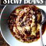 A bowl of slow cooker beans over polenta.