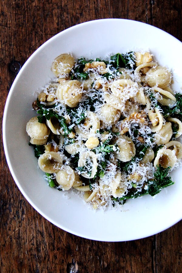 This recipe for orecchiette with Swiss chard, brown butter and walnuts is another version of a favorite recipe I make all winter with Brussels sprouts. Here, the pasta is simply drained over the chard or kale — just enough to wilt it — and when you use baby Swiss chard or kale it is especially good. // alexandracooks.com A bowl of orecchiette with Swiss chard, brown butter and walnuts.