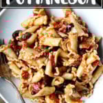 A plate of pasta puttanesca.