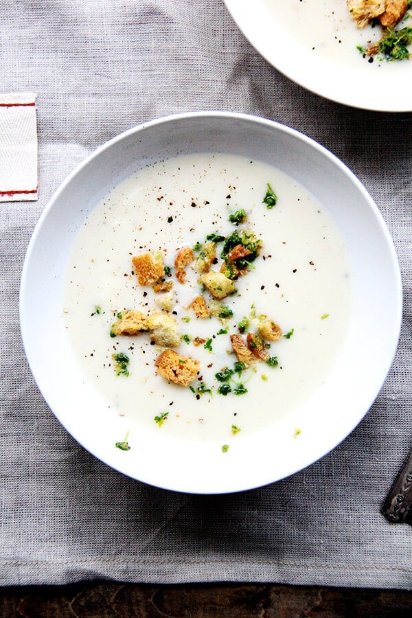 Recently, I've been living on this recipe for Fisher's creamy potato soup. Simple and delicious, the ingredients come together quickly: sauté two onions, add four peeled potatoes and water, simmer till tender, add milk (thickened with a roux), and purée. A deeply satisfying soup perfect for the colder months of the year! // alexandracooks.com Recently, I've been living on this recipe for Fisher's creamy potato soup. Simple and delicious, the ingredients come together quickly: sauté two onions, add four peeled potatoes and water, simmer till tender, add milk (thickened with a roux), and purée. A deeply satisfying soup perfect for the colder months of the year! // alexandracooks.com