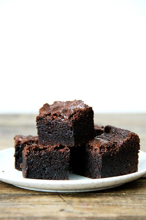 A stack of the best ever fudgy brownie recipe on a plate.