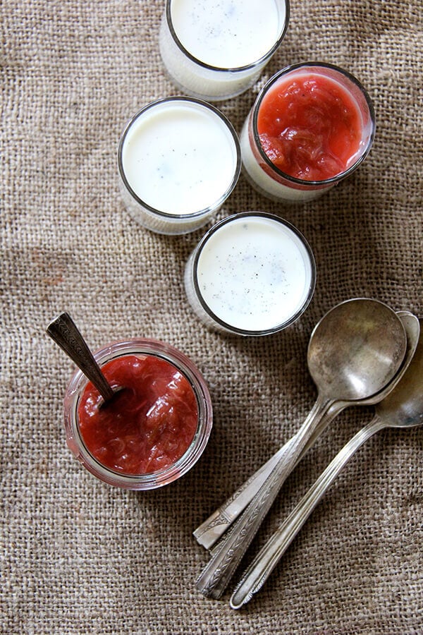 This rhubarb compote is delicious and easy and light (tasting, at least). It also found purpose for the rhubarb I had picked up last week: a sweet-tart lemony compote, a perfect spring lily-gilding condiment. // alexandracooks.com Overhead shot of buttermilk panna cotta with rhubarb compote and spoons.