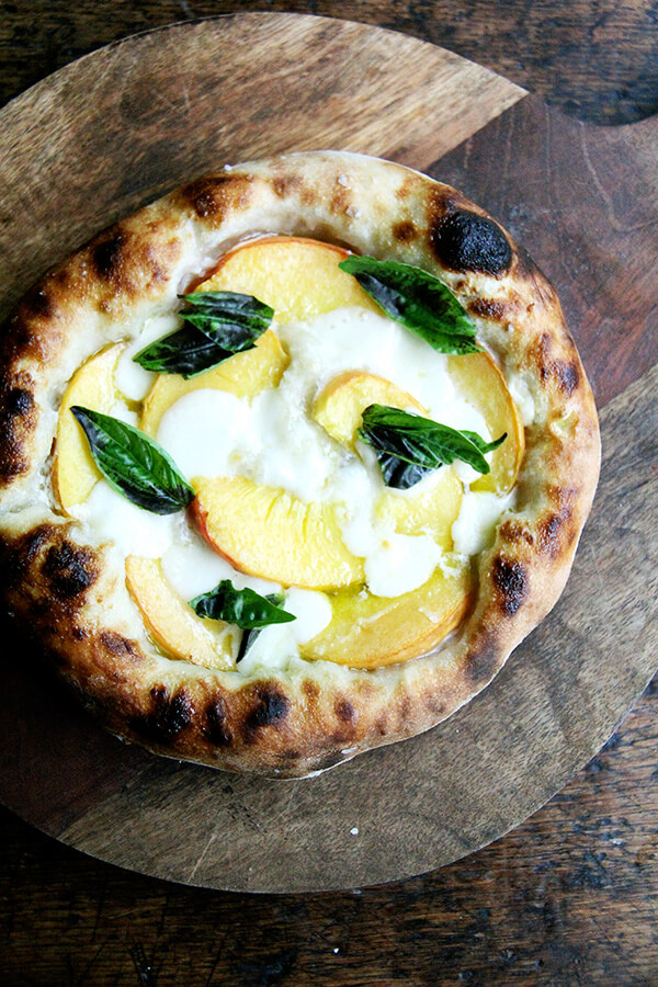 Here are recipes for three summer pizzas — peach and basil, broccoli rabe and sausage, and roasted red pepper and tomato — plus a few pizza-making tips. And even in the summer heat, each colorful crème fraîche-slicked pie makes every second spent in my sultry kitchen well worth it. // alexandracooks.com Here are recipes for three summer pizzas — peach and basil, broccoli rabe and sausage, and roasted red pepper and tomato — plus a few pizza-making tips. And even in the summer heat, each colorful crème fraîche-slicked pie makes every second spent in my sultry kitchen well worth it. // alexandracooks.com
