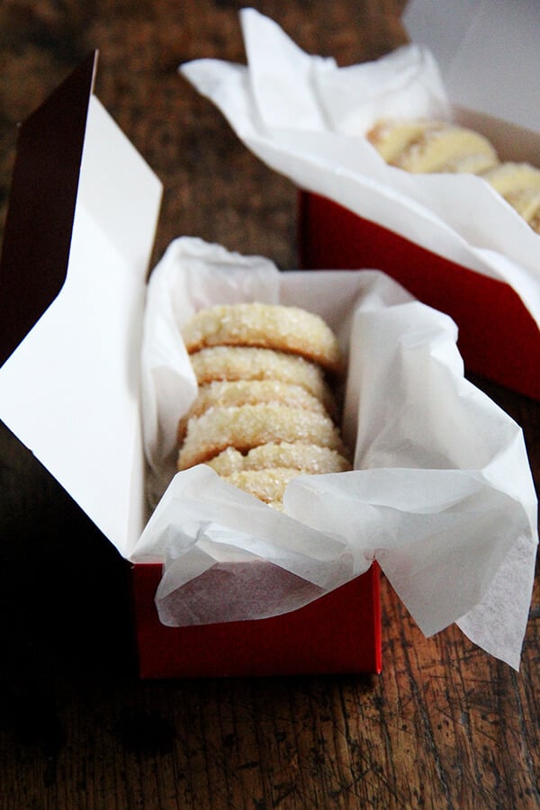 Sable cookies, which I find completely irresistible, are perfectly sweet, nicely salty, and sandy textured. My family gobbled these up so quickly that I vow to make triple batches of sablés from here on out! // alexandracooks.com Boxes of vanilla bean sablé cookies.