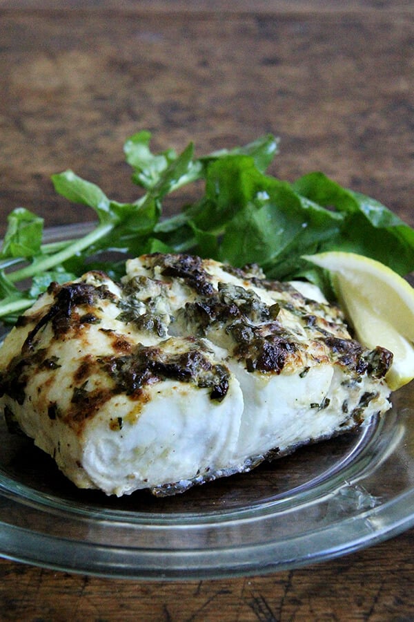 Here, a simple mixture of mayonnaise, mustard, capers, lemon zest and parsley has been spread atop the halibut fillets before cooking. It browns beautifully under the broiler, creating a thin, tasty crust. The fish needs nothing more than a squeeze of lemon upon serving. // alexandracooks.com Here, a simple mixture of mayonnaise, mustard, capers, lemon zest and parsley has been spread atop the halibut fillets before cooking. It browns beautifully under the broiler, creating a thin, tasty crust. The fish needs nothing more than a squeeze of lemon upon serving. // alexandracooks.com