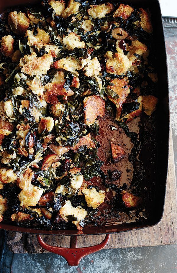 Sometimes all you want is a no-frills stuffing: bread tossed with seasoning, mixed with copious amounts of butter, onions, and celery. But sometimes you want a stuffing studded with dried cranberries and chestnuts, laced with sweet onions (also sautéed in copious amounts of butter), strewn with kale that crisps up like chips as irresistible as the crusty cubes it surrounds. You can have both. // alexandracooks.com Sometimes all you want is a no-frills stuffing: bread tossed with seasoning, mixed with copious amounts of butter, onions, and celery. But sometimes you want a stuffing studded with dried cranberries and chestnuts, laced with sweet onions (also sautéed in copious amounts of butter), strewn with kale that crisps up like chips as irresistible as the crusty cubes it surrounds. You can have both. // alexandracooks.com