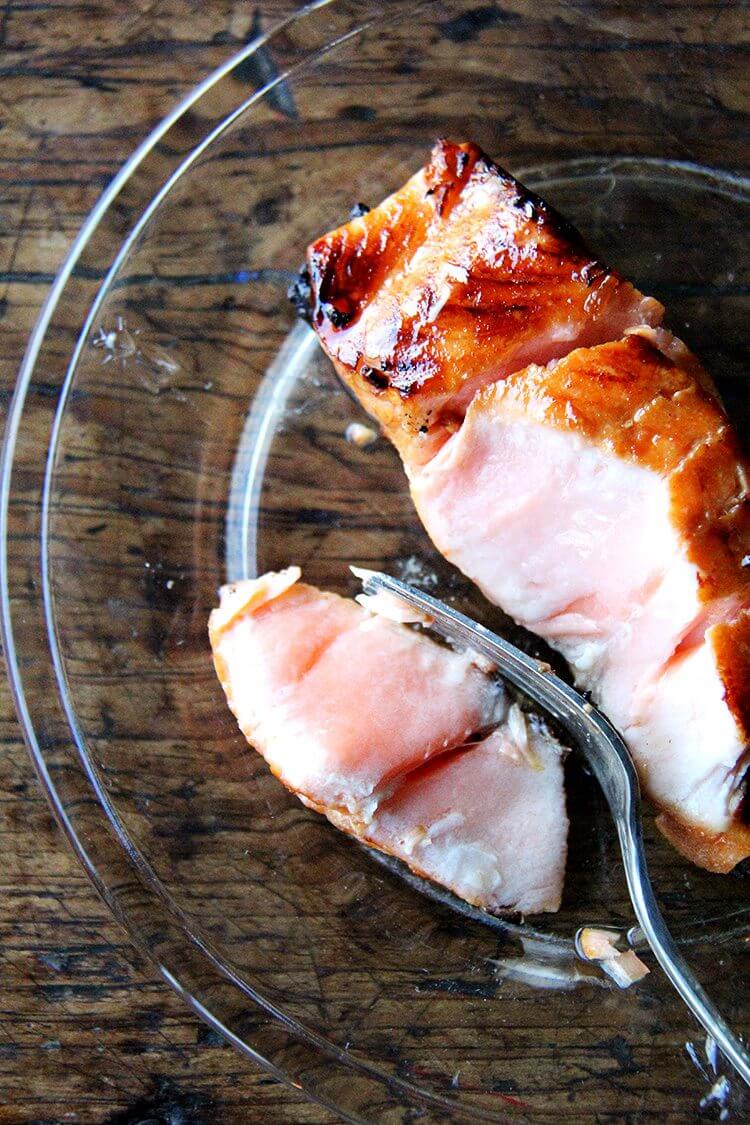 I love this recipe for broiled ginger-soy salmon, which I've made many times over the years. While I've always kept the marinade exactly the same, I've experimented with various cooking methods to avoid having to flip the fish. This method, starting under the broiler and finishing in a hot skillet, is the one I liked best. // alexandracooks.com A plate of broiled ginger-soy salmon.