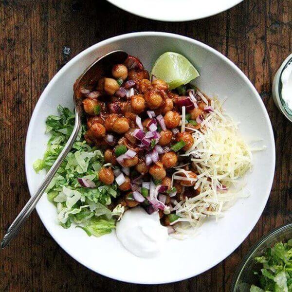 Assembled bowls of chickpea taco filling with toppings.