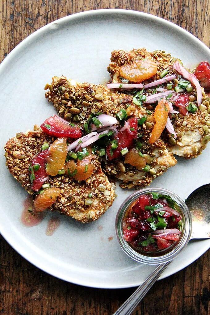 Here's the gist of these pepita-crusted chicken cutlets: toast pumpkin seeds, crush them coarsely, mix with a few spices (smoked paprika or ancho chile powder, cumin and cayenne), then use them to "bread" your cutlets. If you love panko chicken and are looking for a little change, give this one a go—the seeds add such a lovely texture and flavor. // alexandracooks.com Here's the gist of these pepita-crusted chicken cutlets: toast pumpkin seeds, crush them coarsely, mix with a few spices (smoked paprika or ancho chile powder, cumin and cayenne), then use them to "bread" your cutlets. If you love panko chicken and are looking for a little change, give this one a go—the seeds add such a lovely texture and flavor. // alexandracooks.com