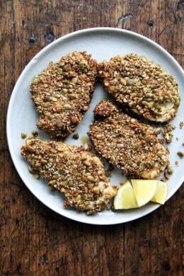 Here's the gist of these pepita-crusted chicken cutlets: toast pumpkin seeds, crush them coarsely, mix with a few spices (smoked paprika or ancho chile powder, cumin and cayenne), then use them to "bread" your cutlets. If you love panko chicken and are looking for a little change, give this one a go—the seeds add such a lovely texture and flavor. // alexandracooks.com