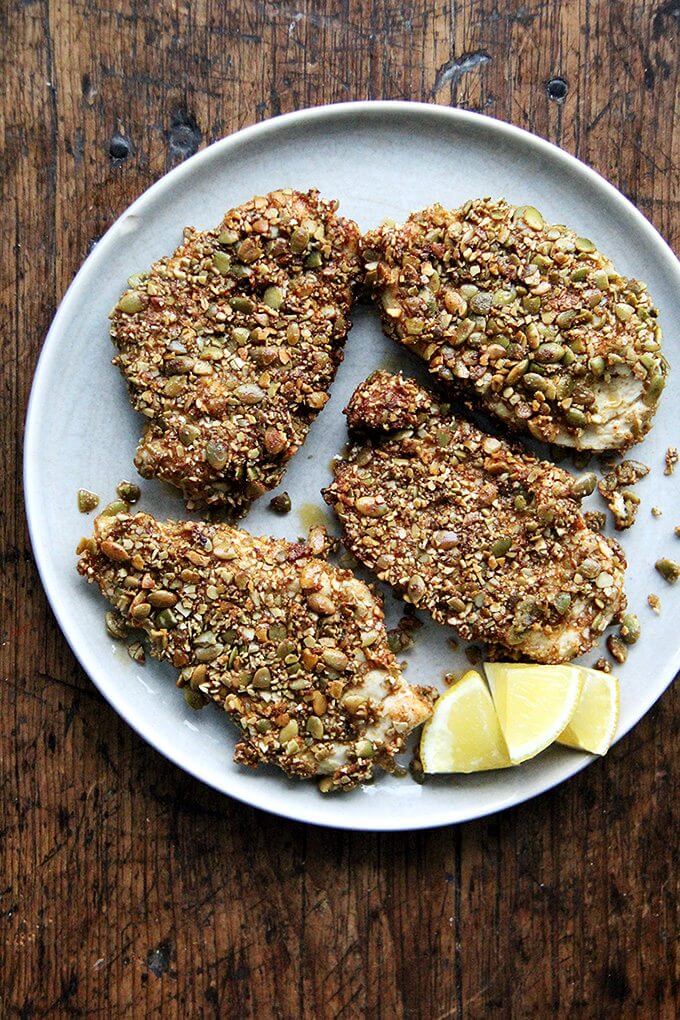 Here's the gist of these pepita-crusted chicken cutlets: toast pumpkin seeds, crush them coarsely, mix with a few spices (smoked paprika or ancho chile powder, cumin and cayenne), then use them to "bread" your cutlets. If you love panko chicken and are looking for a little change, give this one a go—the seeds add such a lovely texture and flavor. // alexandracooks.com Here's the gist of these pepita-crusted chicken cutlets: toast pumpkin seeds, crush them coarsely, mix with a few spices (smoked paprika or ancho chile powder, cumin and cayenne), then use them to "bread" your cutlets. If you love panko chicken and are looking for a little change, give this one a go—the seeds add such a lovely texture and flavor. // alexandracooks.com