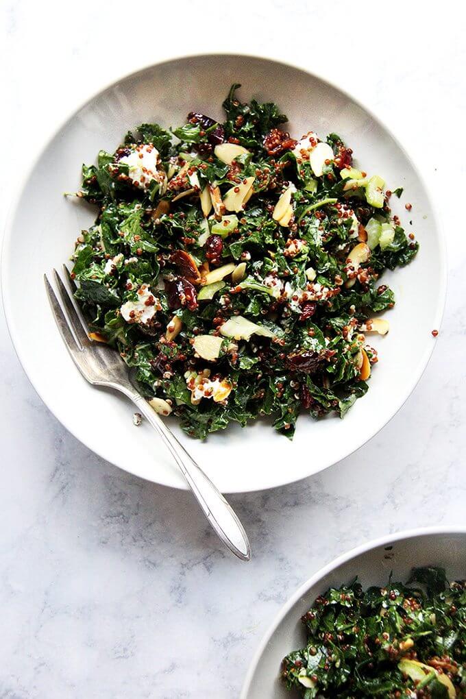This kale and quinoa salad has a lemony-mustard dressing, dried cranberries that plump with the cooked quinoa, crisp celery, toasted almonds, and goat cheese. It comes together in a snap and has been aย welcomed addition to the summer salad rotation. It also keeps well in the fridge for days, making it perfect for lunch-on-the-go or a picnic at the beach. I find it irresistible, and while it's a great side salad, it's nearly a meal in itself. // alexandracooks.com