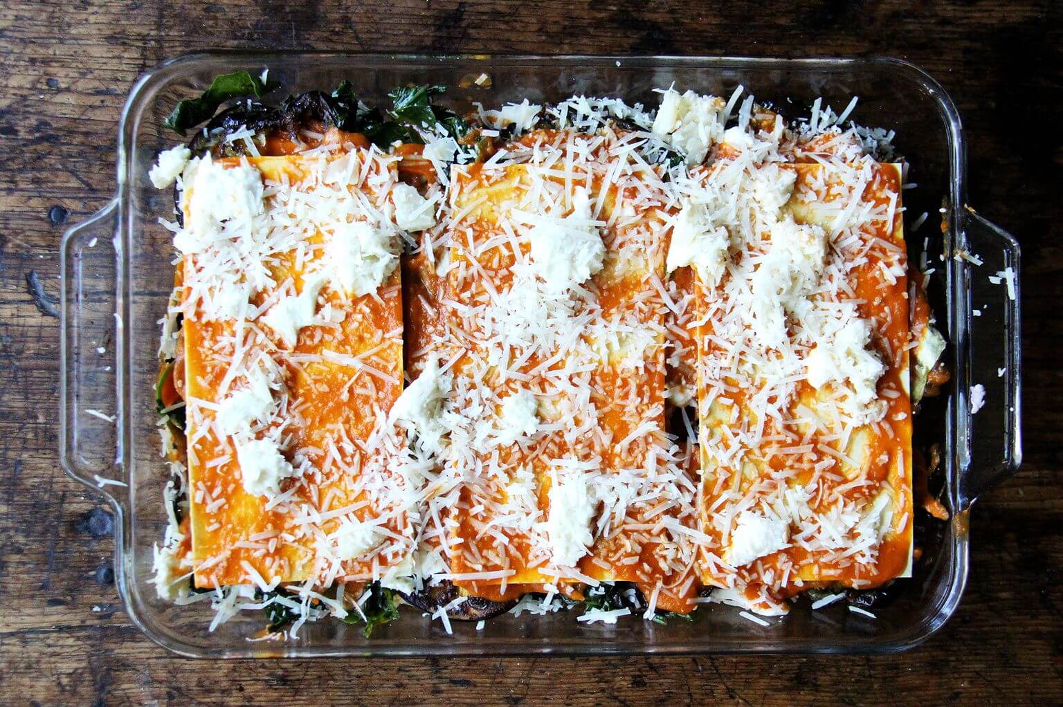 An assembled unbaked roasted eggplant lasagna.