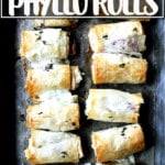 Salami and provolone phyllo rolls on a board.